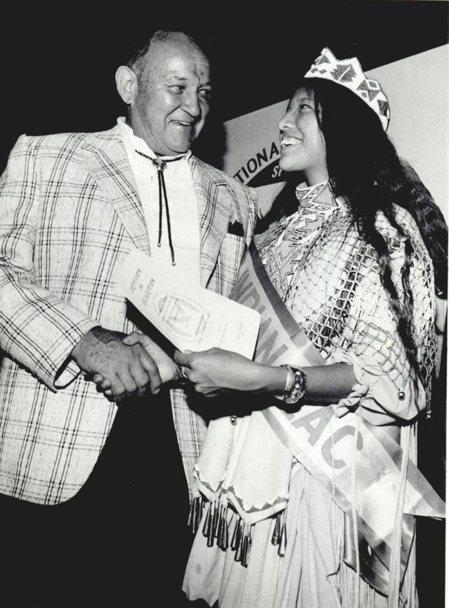 In this 1979 photo Allie Reynolds presents Mary Titla of San Carlos, Ariz., Miss Indian Eastern Arizona, a certificate in recognition of her youth leadership efforts (photo courtesy of the Oklahoma Historical Society).